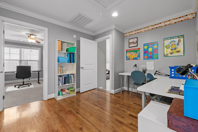 office space featuring ceiling fan, ornamental molding, and hardwood / wood-style floors