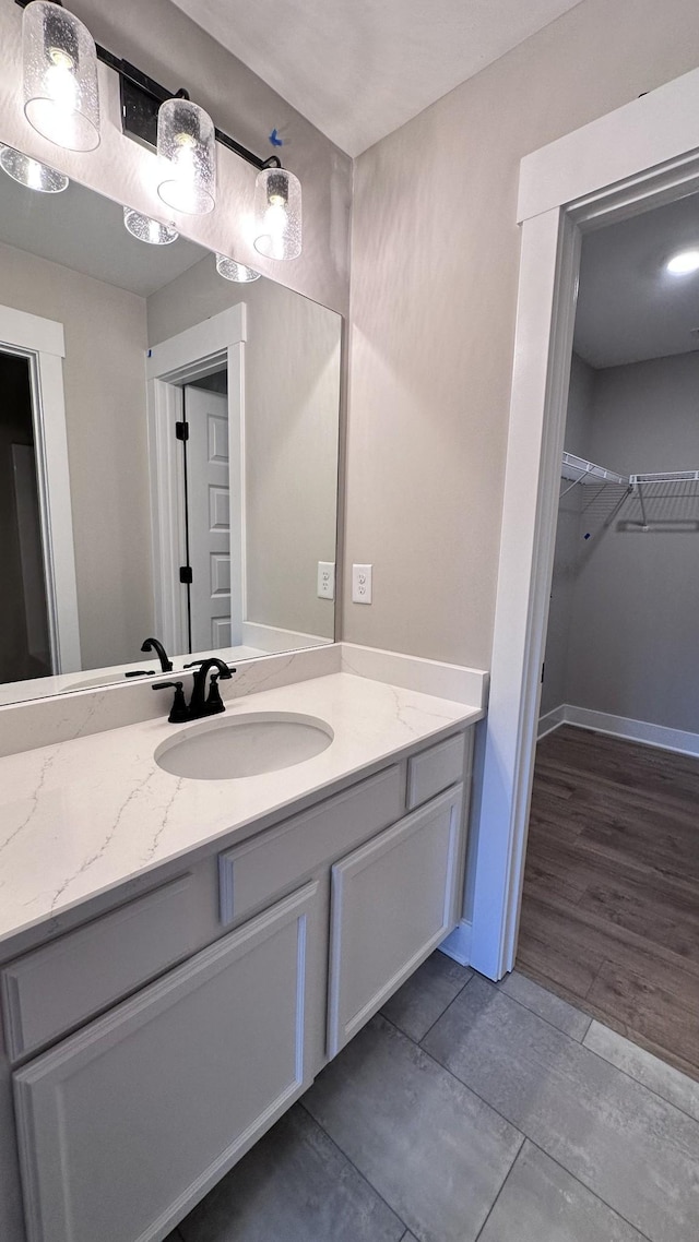 bathroom featuring vanity and hardwood / wood-style floors