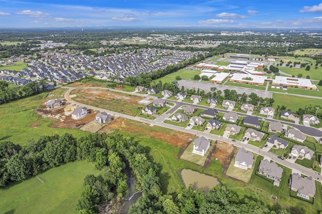 birds eye view of property with a residential view