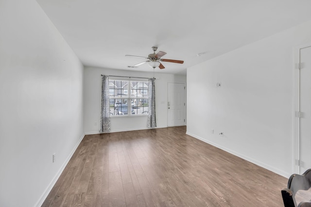 spare room featuring hardwood / wood-style flooring and ceiling fan