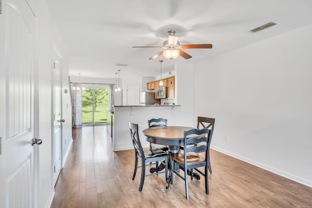 dining room featuring ceiling fan and light hardwood / wood-style floors