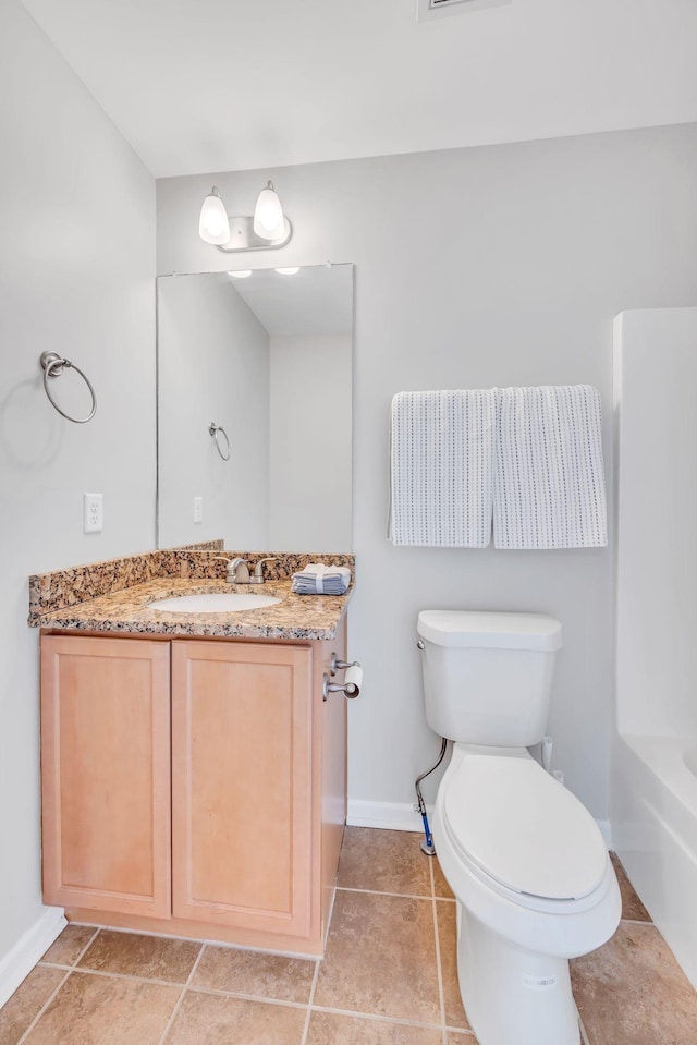 bathroom with vanity, a bath, tile patterned floors, and toilet