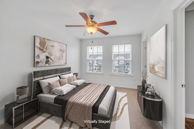 carpeted bedroom with ceiling fan