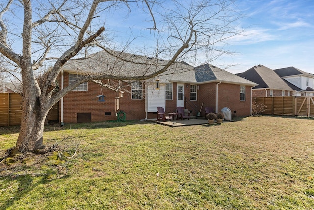 back of property featuring a patio area and a lawn