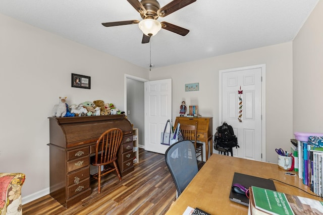 office space with dark hardwood / wood-style floors, a textured ceiling, and ceiling fan