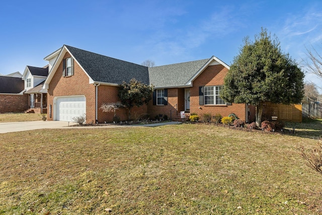 view of front of home featuring a garage and a front yard