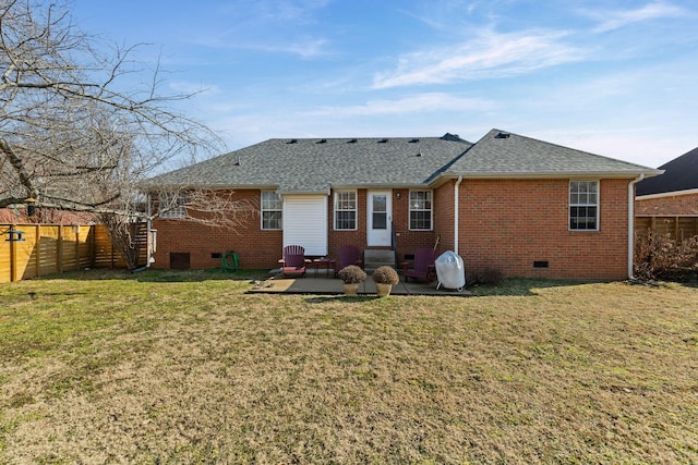 rear view of house with a yard and a patio area