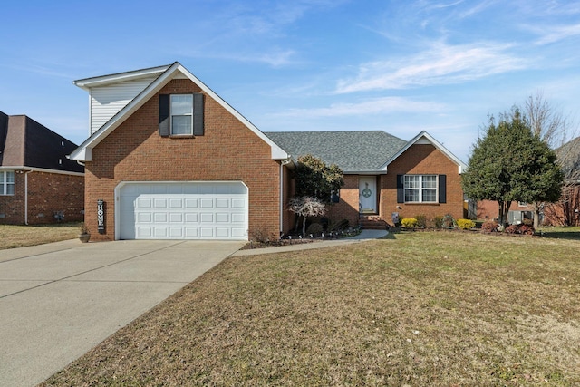 view of front of home with a garage and a front lawn