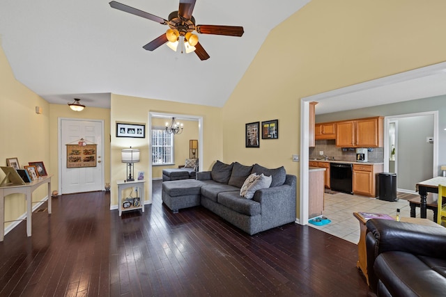 living room featuring ceiling fan with notable chandelier, light hardwood / wood-style flooring, and high vaulted ceiling