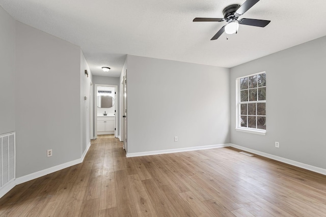 unfurnished room with light hardwood / wood-style floors and ceiling fan