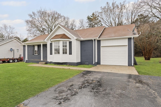 ranch-style home with a front yard and a garage