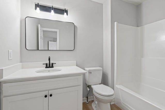 full bathroom featuring vanity, shower / tub combination, toilet, and hardwood / wood-style floors