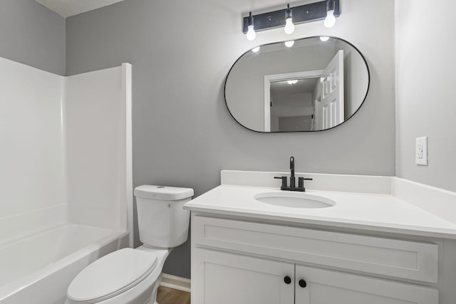 full bathroom featuring shower / bath combination, vanity, and toilet