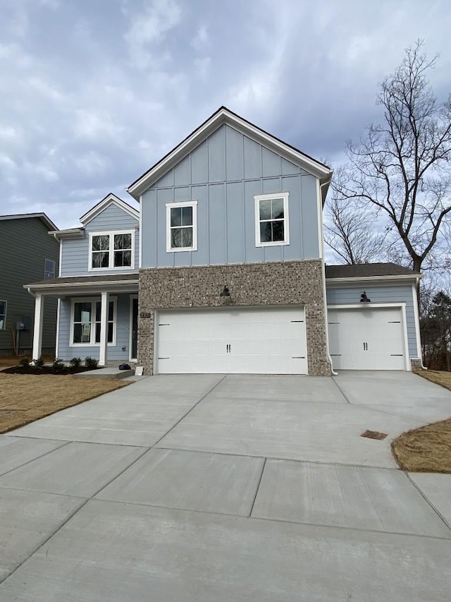 view of front of house featuring a garage and a porch