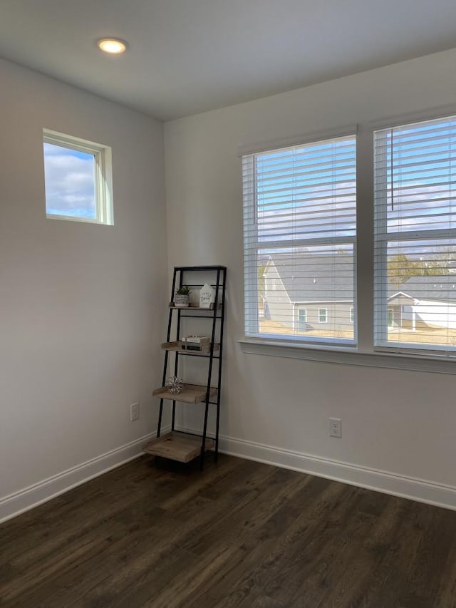 unfurnished room featuring dark hardwood / wood-style flooring