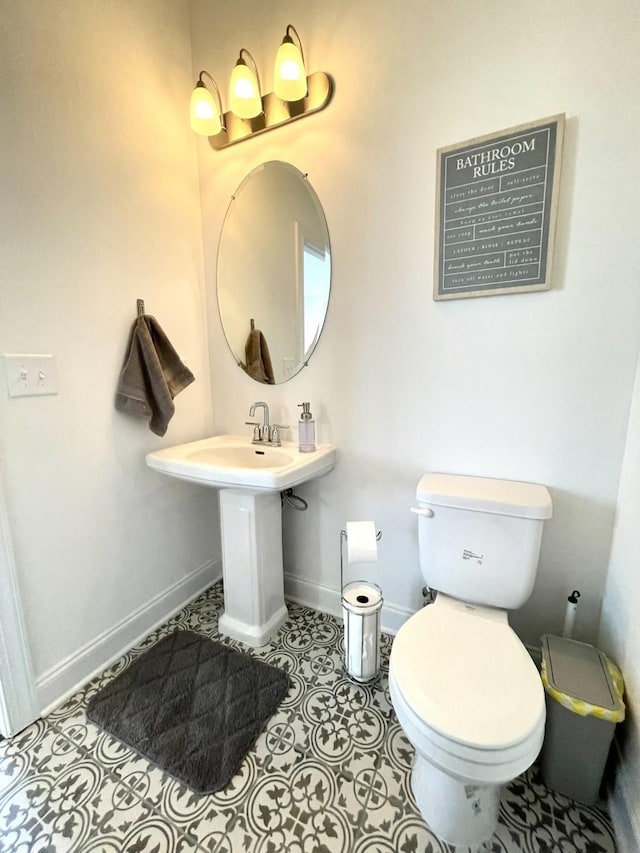 bathroom featuring tile patterned floors and toilet