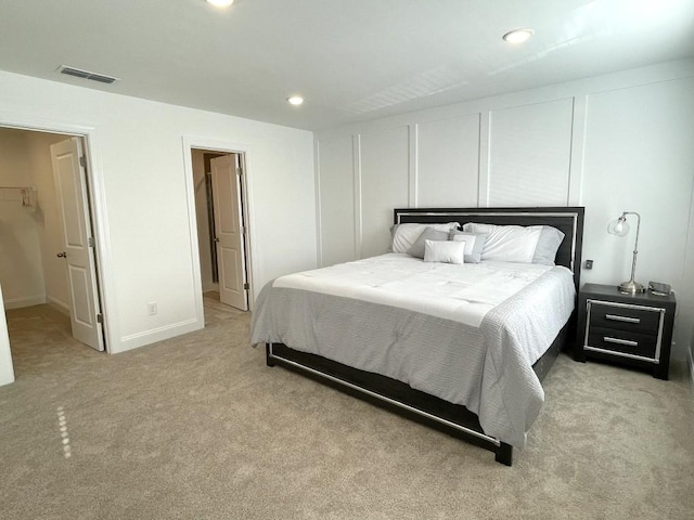 bedroom featuring light carpet