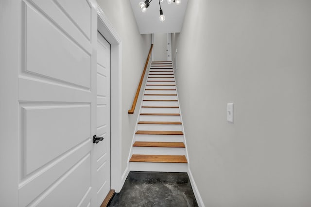 stairway with concrete flooring