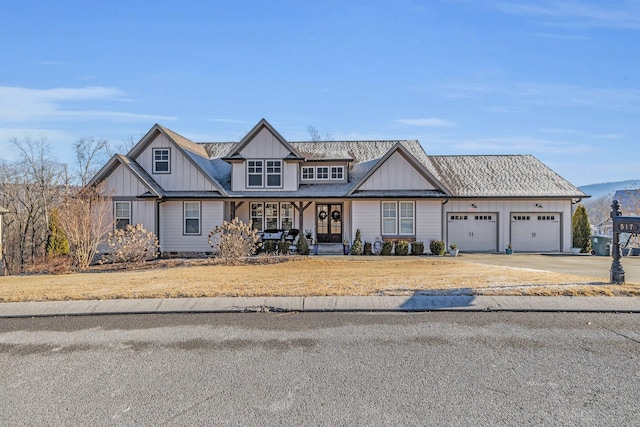 view of front facade featuring a garage and covered porch