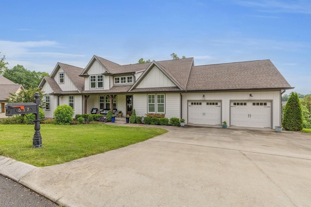 517 Kestrel Ln, Chattanooga, TN 37419 - view of front of home featuring board and batten siding, an attached garage, concrete driveway, a front lawn, and a porch