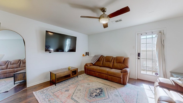 living room with ceiling fan and wood-type flooring