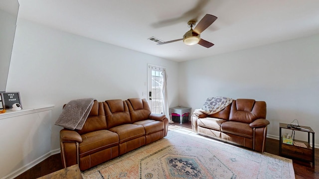 living room with hardwood / wood-style flooring and ceiling fan