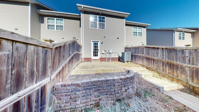 back of property featuring central AC and a patio