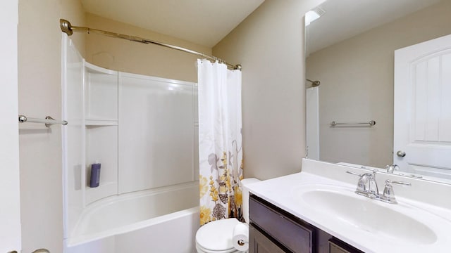 full bathroom featuring vanity, shower / bath combination with curtain, and toilet