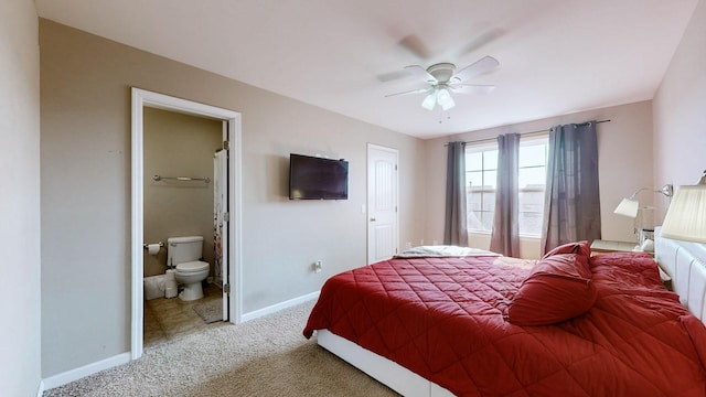 carpeted bedroom featuring ceiling fan and ensuite bathroom