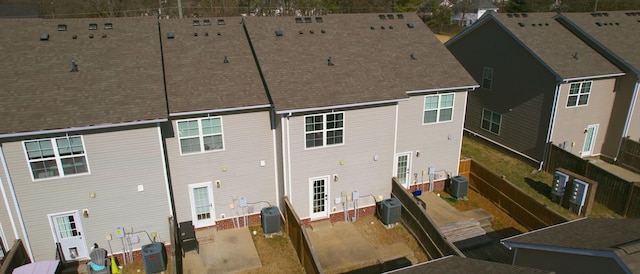 rear view of house with central AC