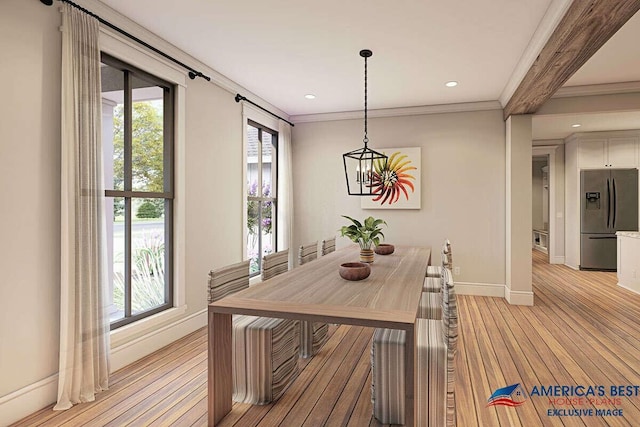 dining room with crown molding, light wood-type flooring, and a wealth of natural light