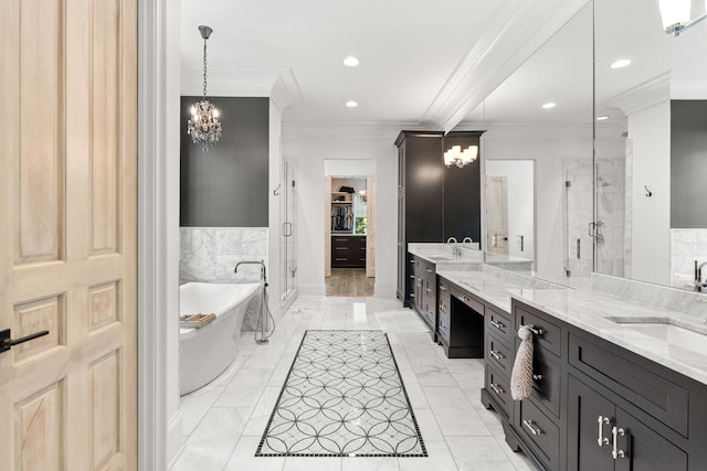 bathroom featuring independent shower and bath, vanity, ornamental molding, and a notable chandelier