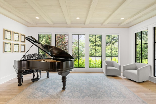 miscellaneous room featuring wooden ceiling, beam ceiling, and light hardwood / wood-style flooring