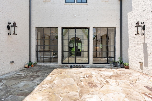 doorway to property featuring a patio area