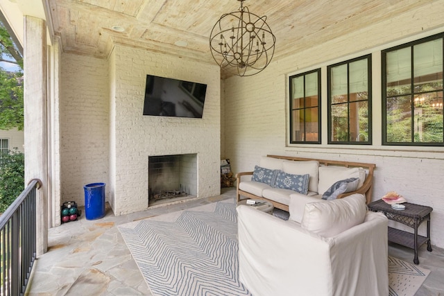 view of patio / terrace with an outdoor brick fireplace