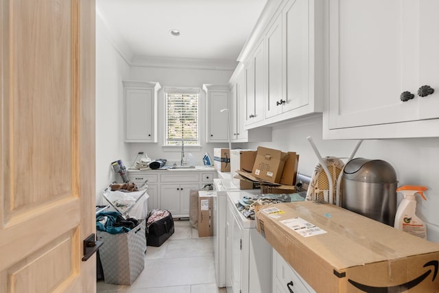 laundry area featuring washer / clothes dryer, ornamental molding, sink, and light tile patterned flooring