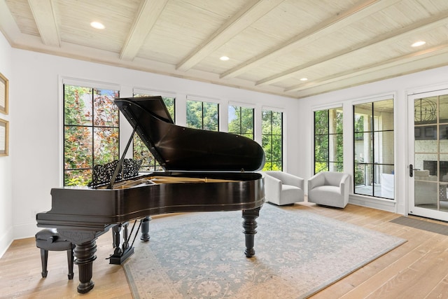 miscellaneous room featuring wooden ceiling, beam ceiling, and light hardwood / wood-style flooring