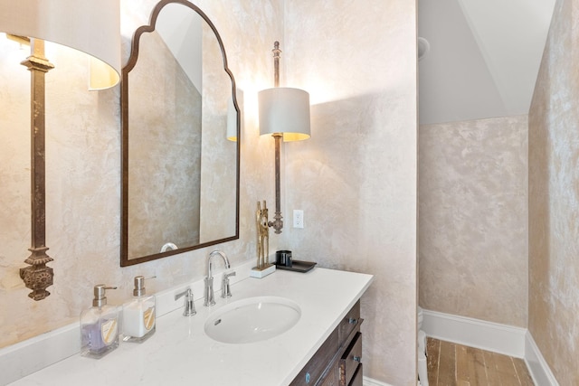 bathroom featuring vanity and hardwood / wood-style floors