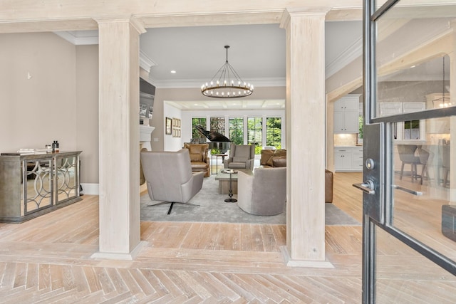 interior space featuring crown molding, parquet flooring, decorative columns, and a notable chandelier