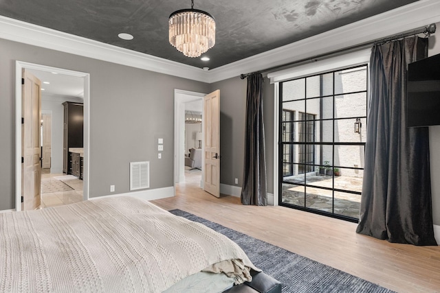 bedroom featuring crown molding, an inviting chandelier, multiple windows, and light wood-type flooring