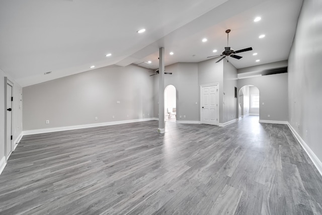 unfurnished living room featuring wood-type flooring, high vaulted ceiling, and ceiling fan