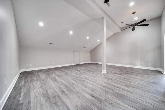 unfurnished living room with hardwood / wood-style flooring, lofted ceiling, and ceiling fan