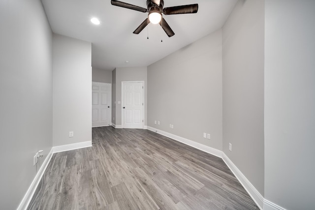 spare room with light hardwood / wood-style floors and ceiling fan