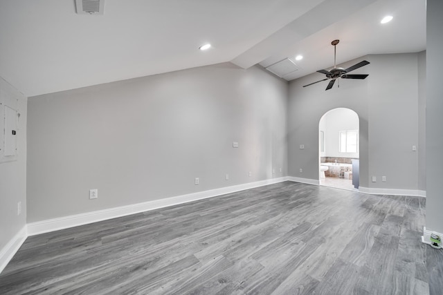 unfurnished living room with hardwood / wood-style flooring, vaulted ceiling, and ceiling fan