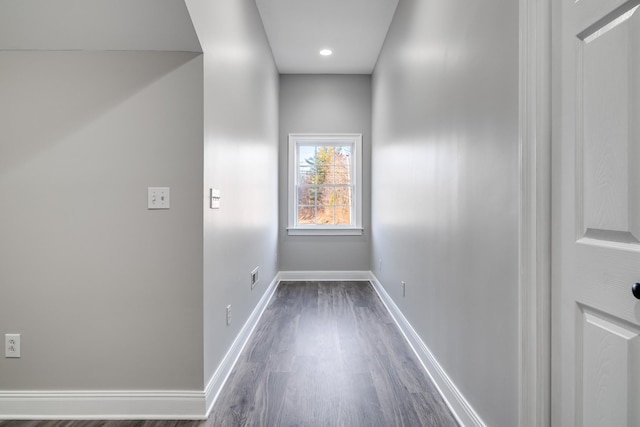 hallway with dark hardwood / wood-style flooring