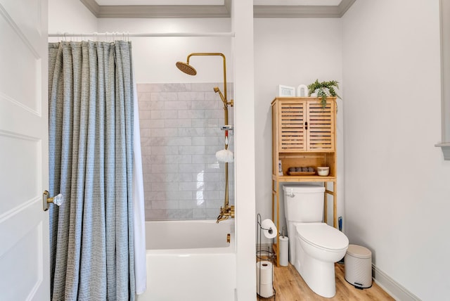 bathroom with shower / tub combo with curtain, hardwood / wood-style flooring, crown molding, and toilet