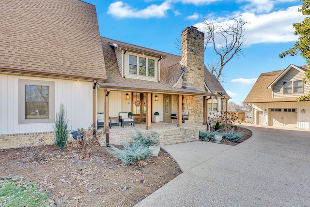 view of front of property with a garage and covered porch