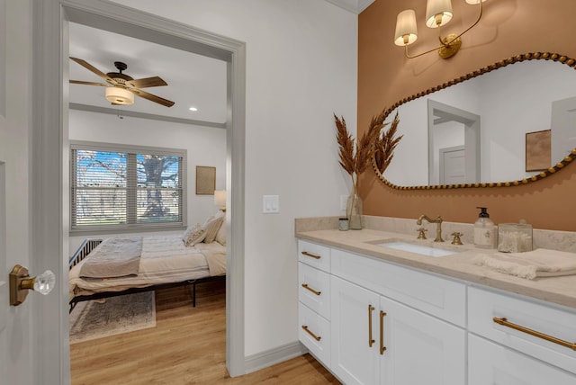 bathroom with vanity, wood-type flooring, and ceiling fan