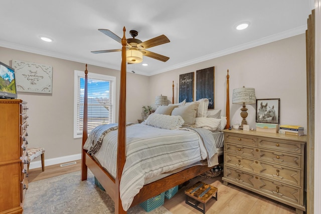 bedroom featuring crown molding, ceiling fan, and light wood-type flooring