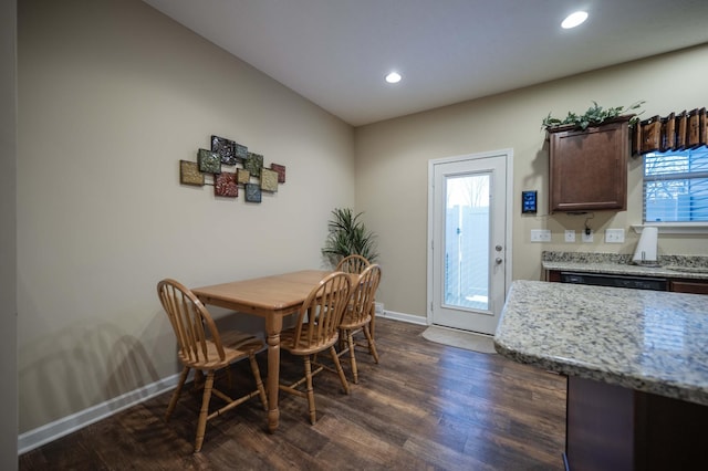 dining area with dark wood-type flooring